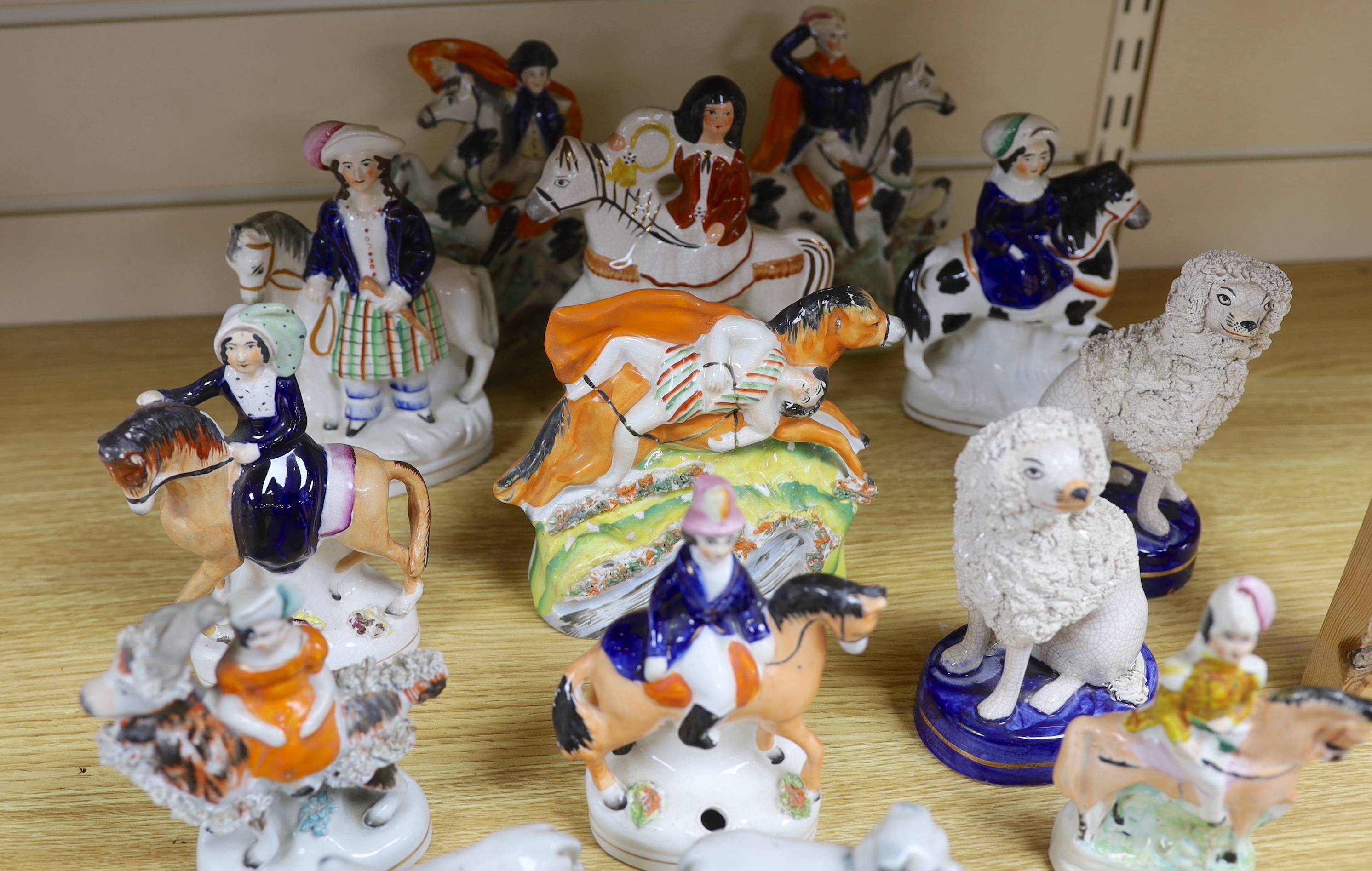 Nine Victorian Staffordshire figures or groups, three reproductions and a pair of Continental porcelain figures of dogs, tallest 17.5cm